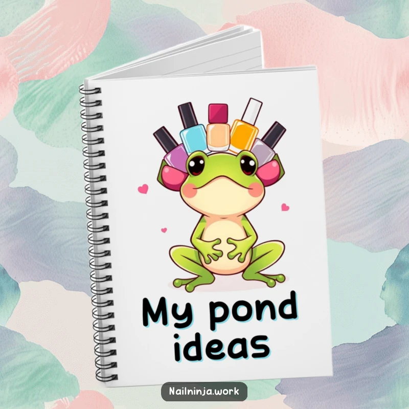 Funny excited green frog balancing nail polish bottles on its head, on a notebook.